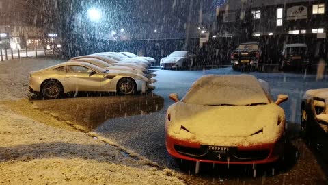 Ferrari car covered with the snow