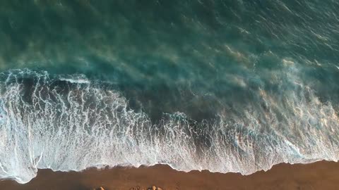 Sea waves and sand