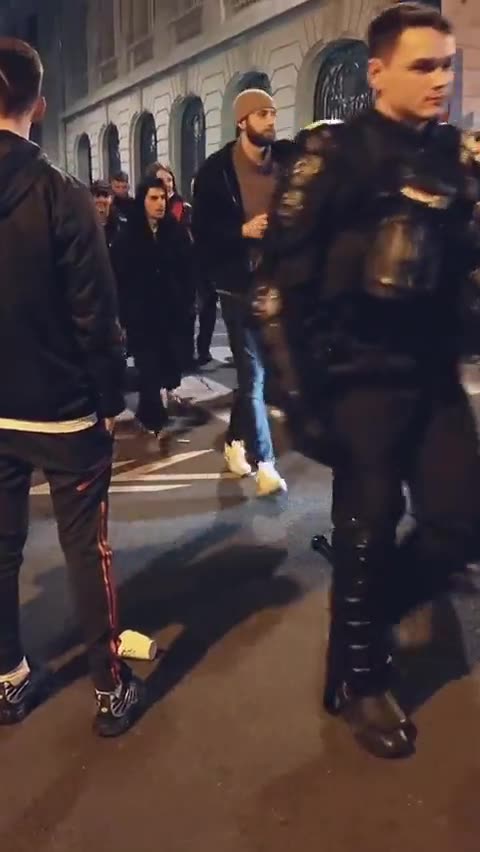 Number of police officers have removed their helmets and are marching with the people in Paris