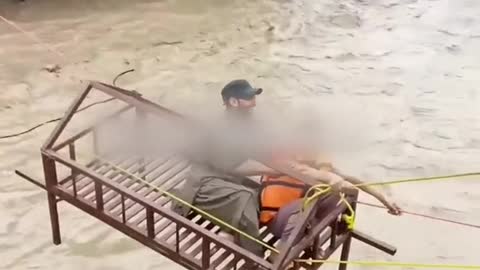 Heroic Volunteers RescueChild From Pakistan'sDevastating Super Floods