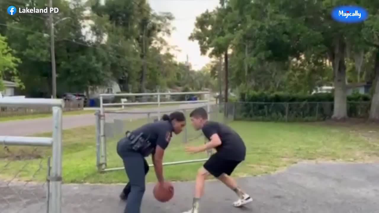 Female police officer schools local teen in game of one on one basketball