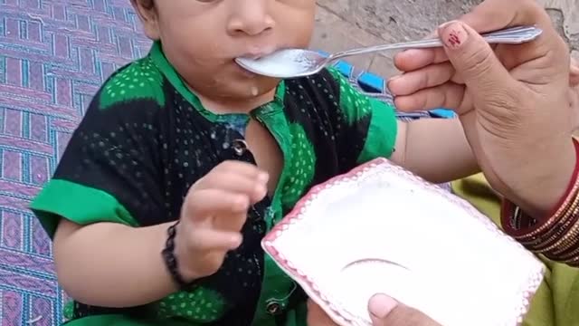 Baby eating kheer mix