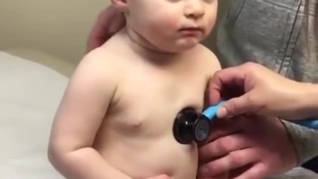 Lovely Sweet Baby Boy Rests Head On Nurse's Hand