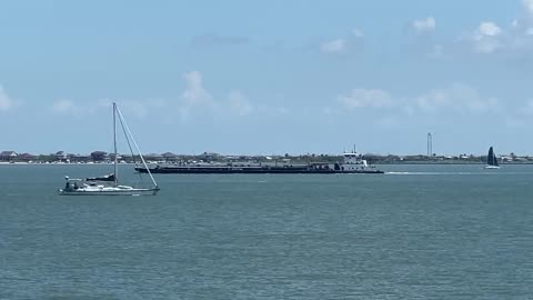 SAILBOAT IN GALVESTON BAY BY BOLIVAR POINT