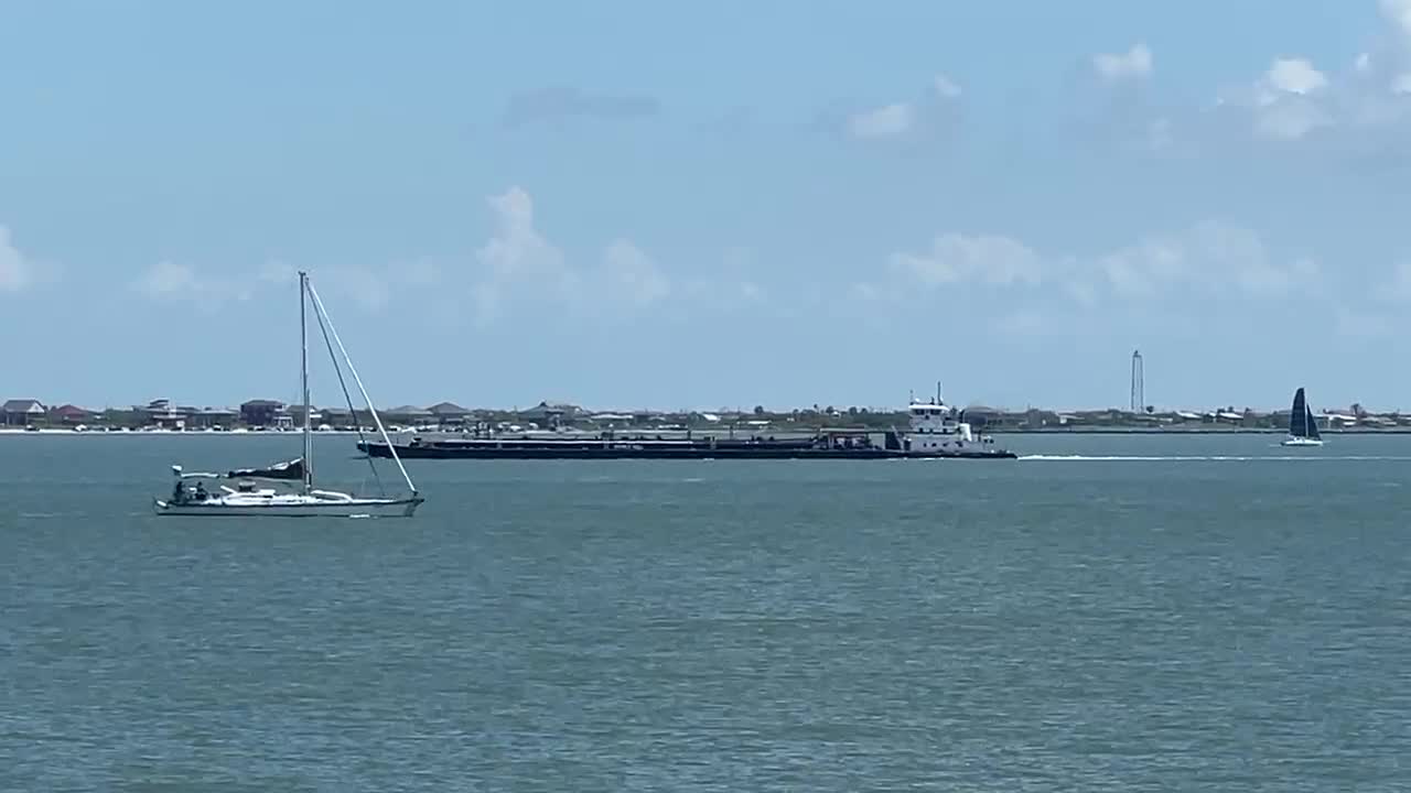 SAILBOAT IN GALVESTON BAY BY BOLIVAR POINT