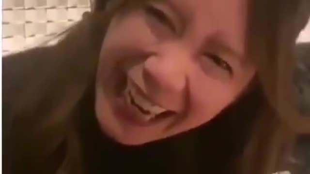 Woman Freezes Mid-Laugh (She had just been jabbed)