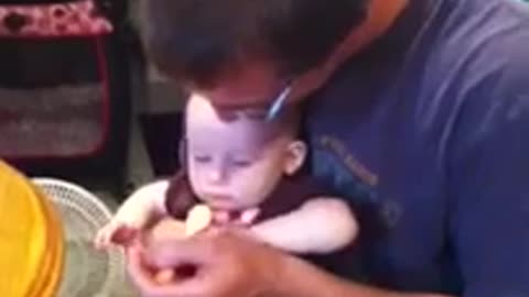 Emma eating applesauce