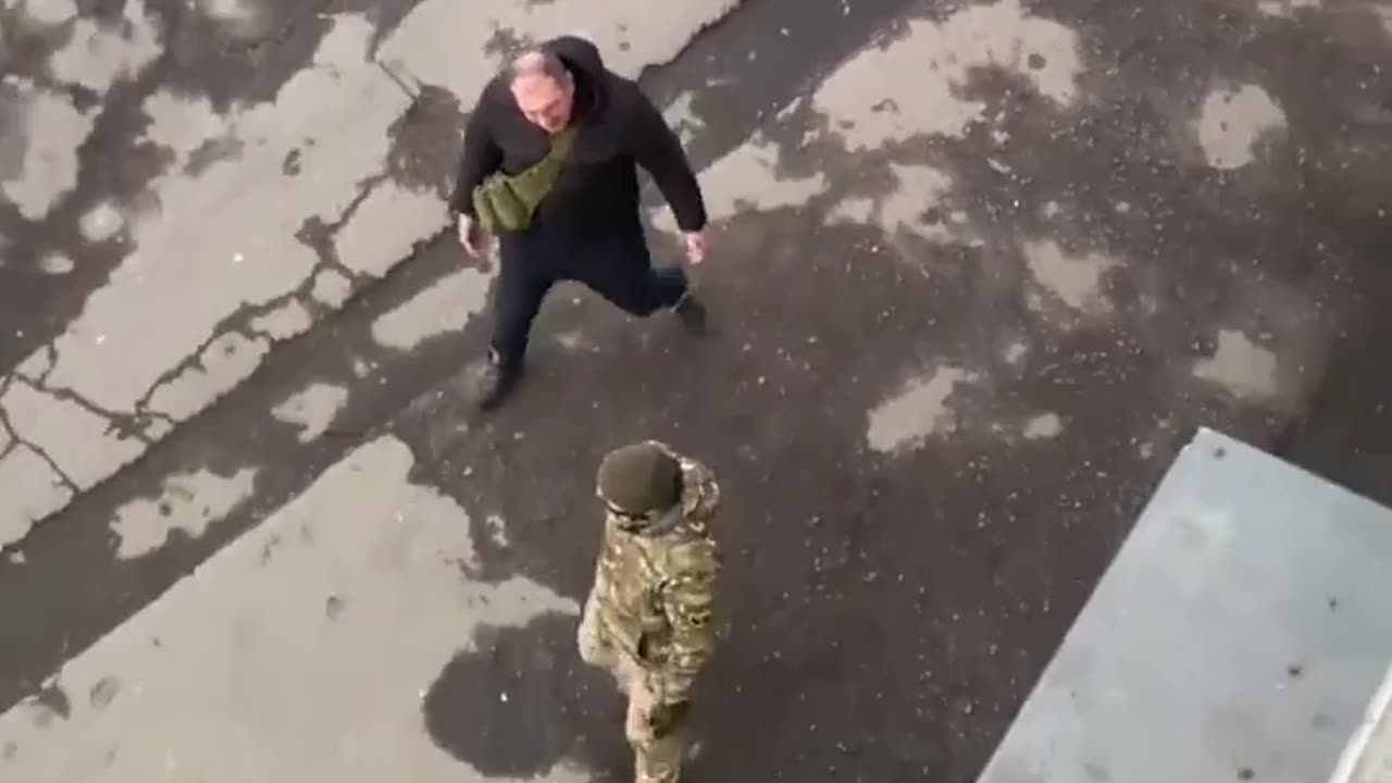 A Ukrainian civilian attacks and chases away a Ukrainian conscription officer