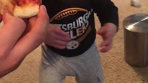 Guaranteed to make you smile ! Baby tries pizza for the first time