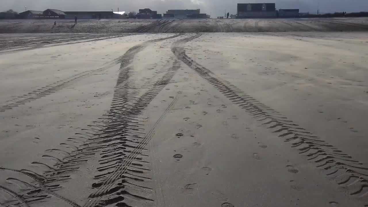 Wind blowing sand all over the beach