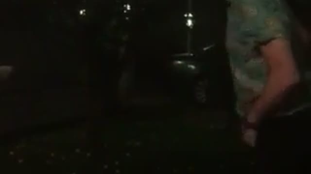 Brown shirt guy tries to kick sign and falls on butt