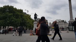 Street performer singing Fast car. Trafalgar square Sep 2022