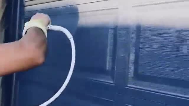 Fast worker painting a door and wall in 55 seconds
