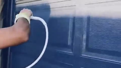 Fast worker painting a door and wall in 55 seconds