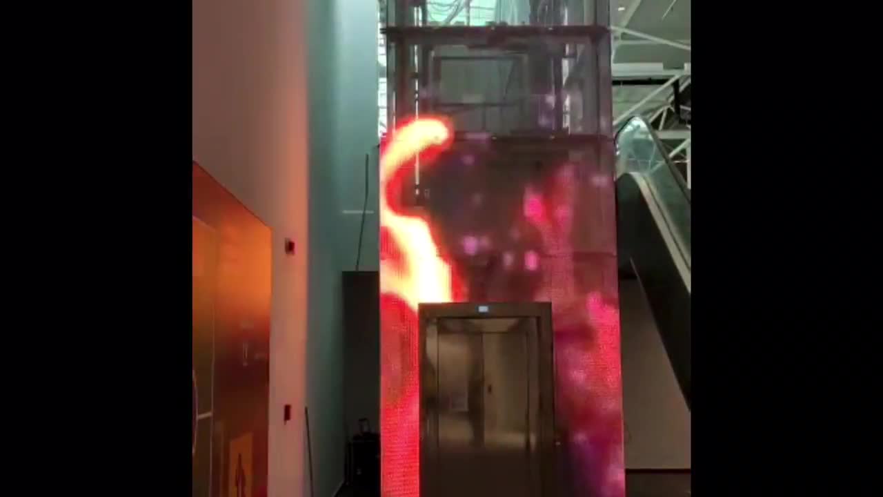 adhesive transparent media displays on glass elevators walls