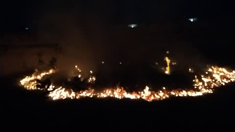 Destroying waste and grass by fire in slow-motion