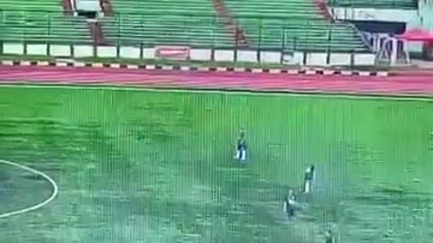Soccer player struck by lightning during match in Indonesia.