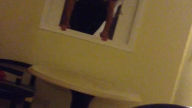 Guy jumps through kitchen window unto table
