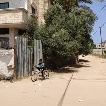 little boy riding a bike