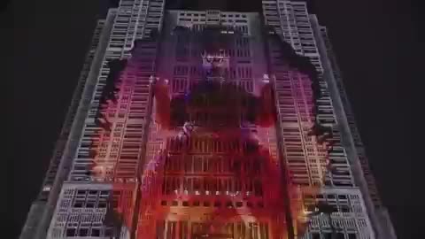 Visitors watched Godzilla, over 300 feet, being displayed on the Tokyo Metropolitan