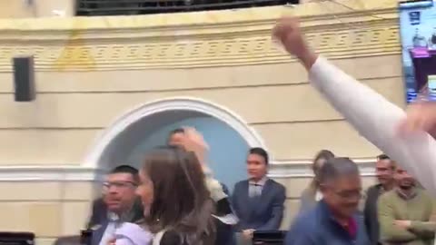 Child marriages banned in Colombia. MPs celebrate in Parliament.