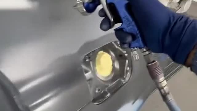 Surface painting of automotive sheet metal