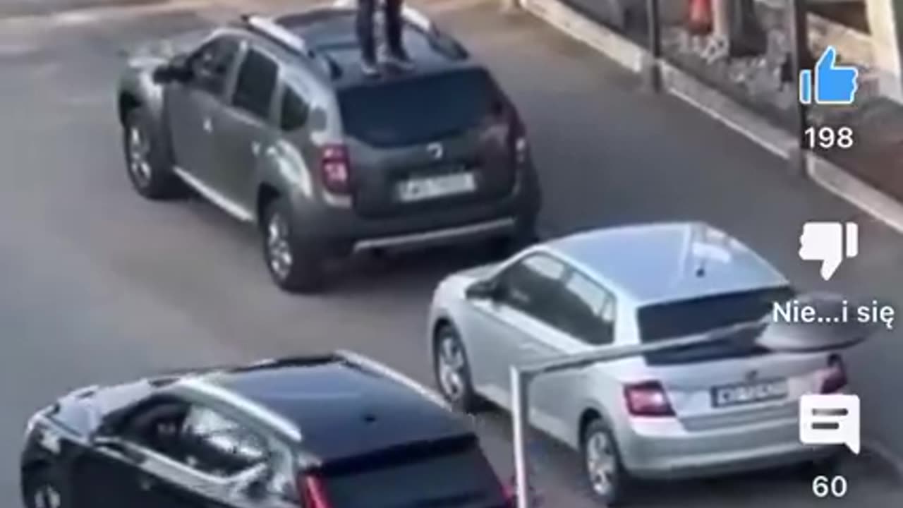 African jumps on cars outside of BMW dealership in Warsaw