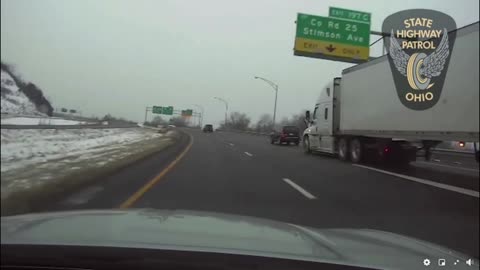 Semi Almost Pushes Police Car into Guardrail