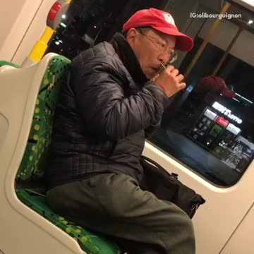 Man red hat shaves on bus
