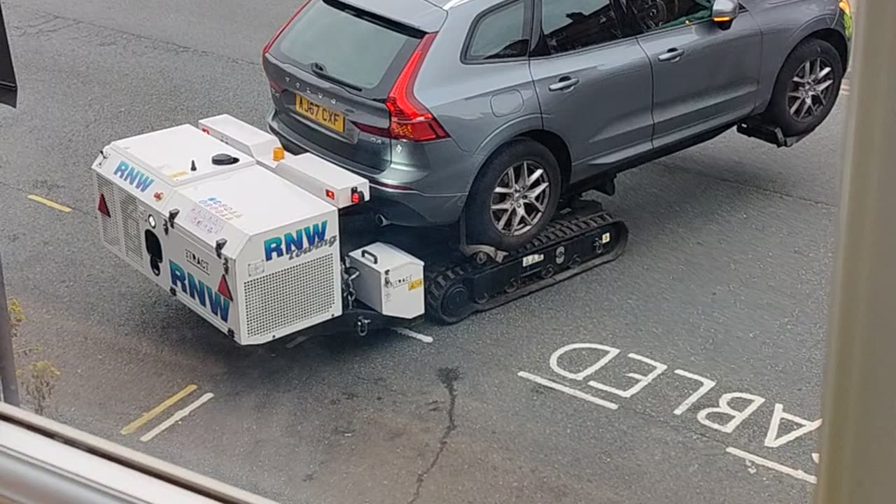 Robot Removes Car From Disabled Parking