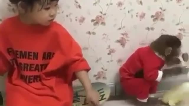Funny monkey and baby girl