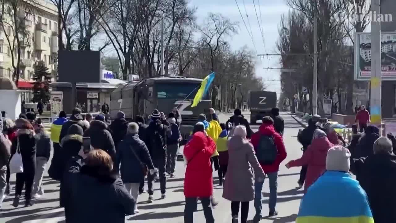 Go home!': Ukrainian protesters confront Russian military vehicles in Kherson