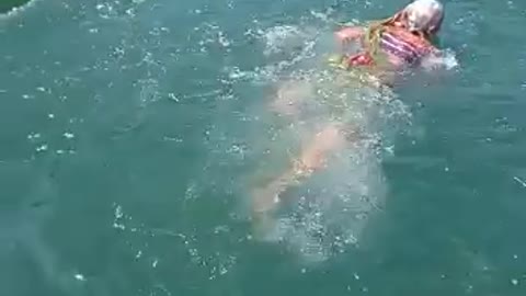 grandmother swiming in village pool india