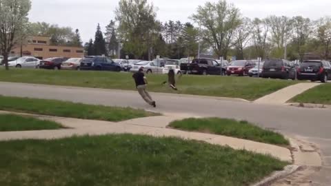 Confident man versus aggressive dominating duck from hell