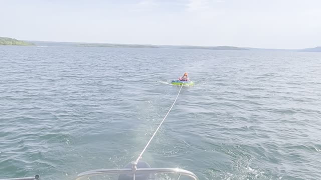 Granddaughter riding tube