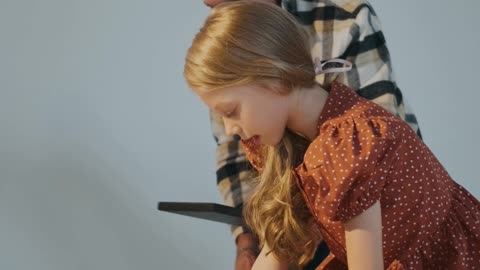 Girl Playing Domino with Her Grandfather