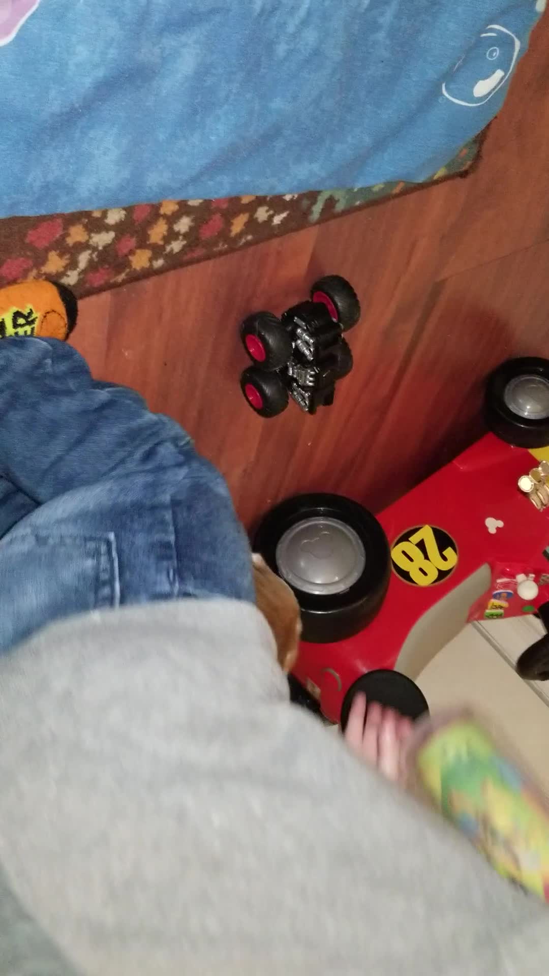 Brown white dog barks at toy truck