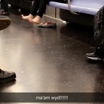 Ma'am wyd woman swings bare feet on subway seat
