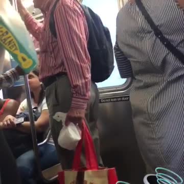 Old man red shirt signing busy train