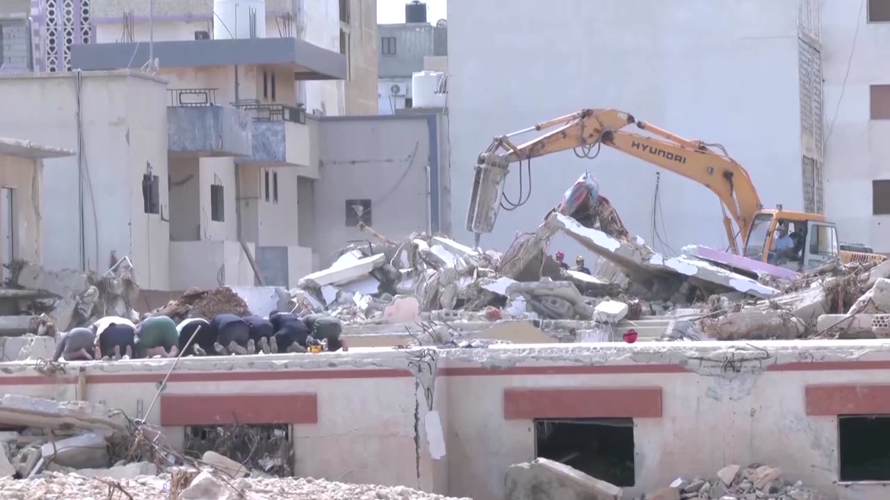 Rescue team pauses search to pray in devastated Derna