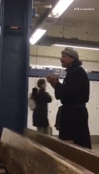 Man in black coat phone charging