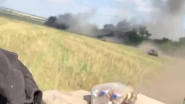 Ukrainian armour forces fleeing during heavy Russian artillery fire.