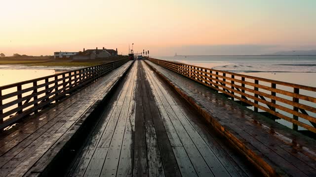 A wooden bridge build above water