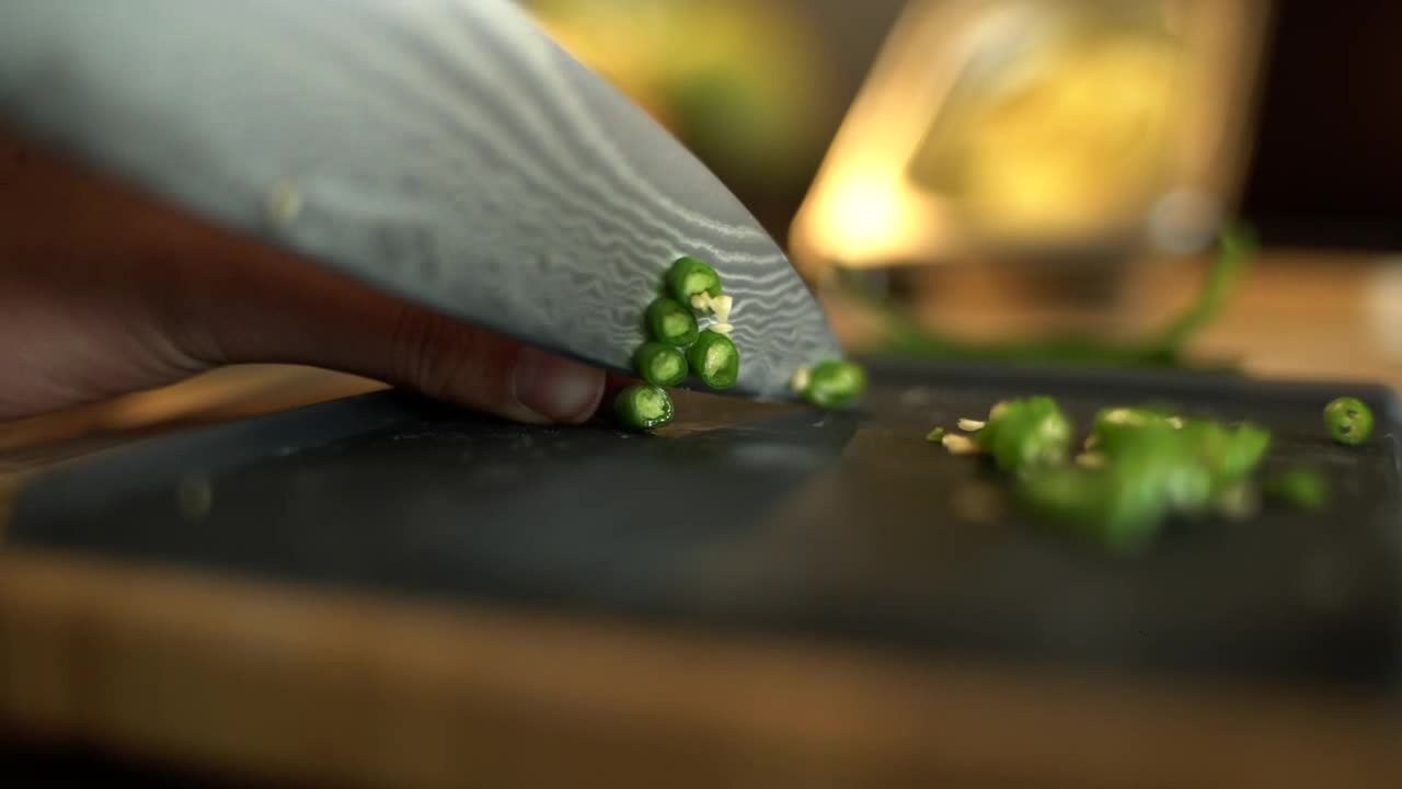 Extreme Close Up of Female Hands Dicing a Green Bean