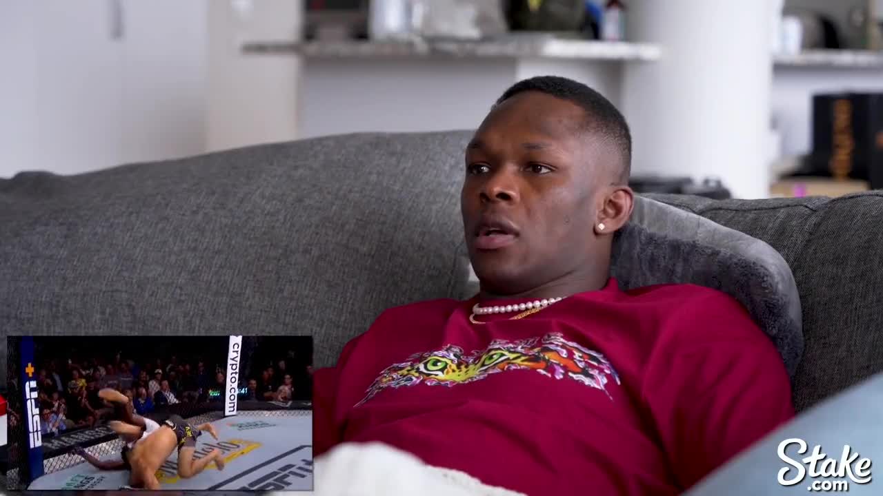 Israel Adesanya Reacts to Khamzat Chimaev vs Kevin Holland at UFC 279