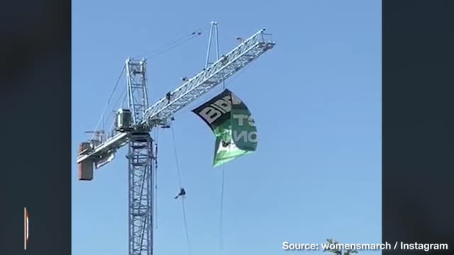 Women Climb D.C. Crane for "Summer of Rage": Drop "Biden, Protect Abortion" Banner