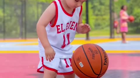 Beautiful boy playing basketball