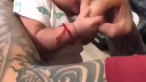 Cute baby angry on dad