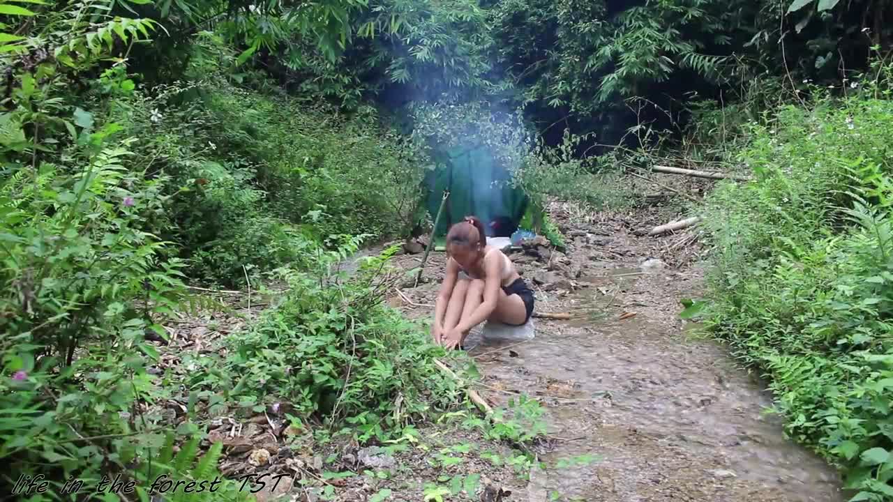 beautiful girl going camping \Create a drinking cup out of bamboo