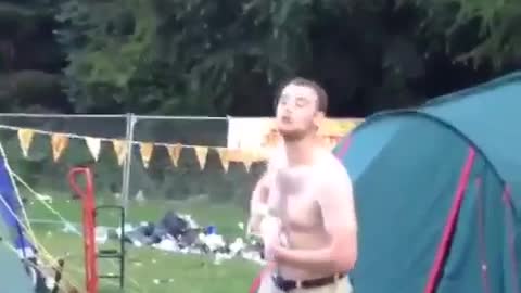 Shirtless guy gets beer spilled on himself